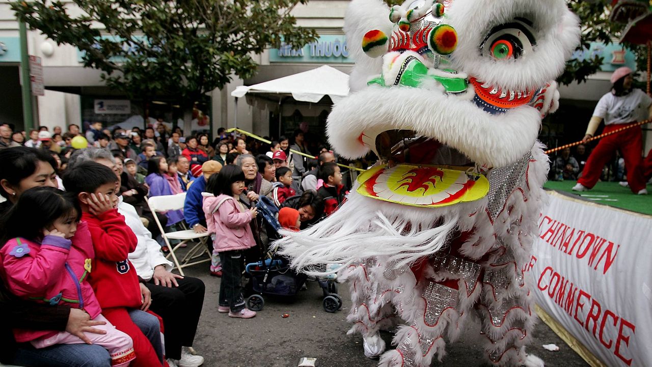 In this Jan. 21, 2006, file photo, Chinese lion dancers perform in Oakland's Chinatown in Oakland, Calif. (AP Photo/Paul Sakuma, File)