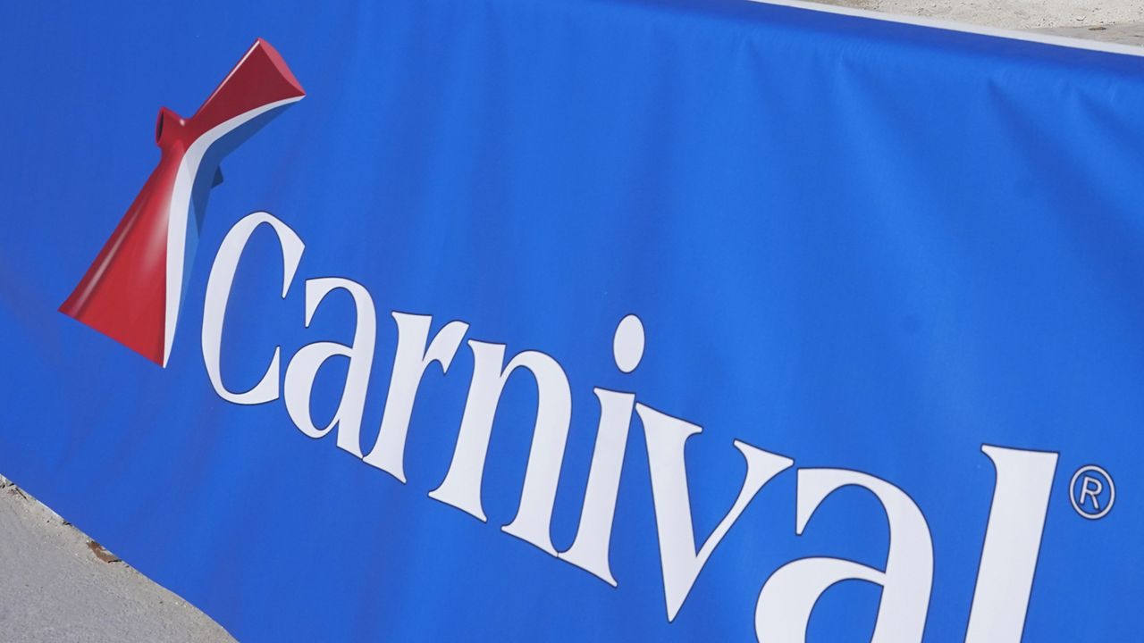 FILE - This Jan. 29, 2021 file photo shows a Carnival Cruise Line sign at PortMiami in Miami. (AP Photo/Lynne Sladky, File)