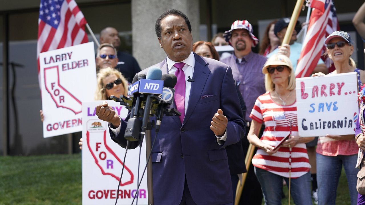 In this July 13, 2021, file photo, radio talk show host Larry Elder speaks to supporters during a campaign stop in Norwalk, Calif. 