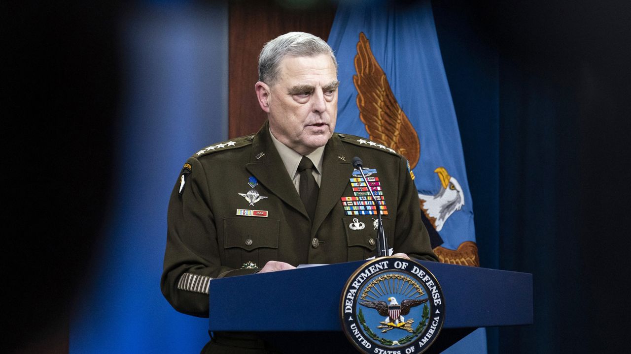 Joint Chiefs Chairman Gen. Mark Milley speaks during a media briefing at the Pentagon, Wednesday, Aug. 18, 2021, in Washington. Milley's image is displayed on television camera monitor as he speaks at top. (AP Photo/Alex Brandon)