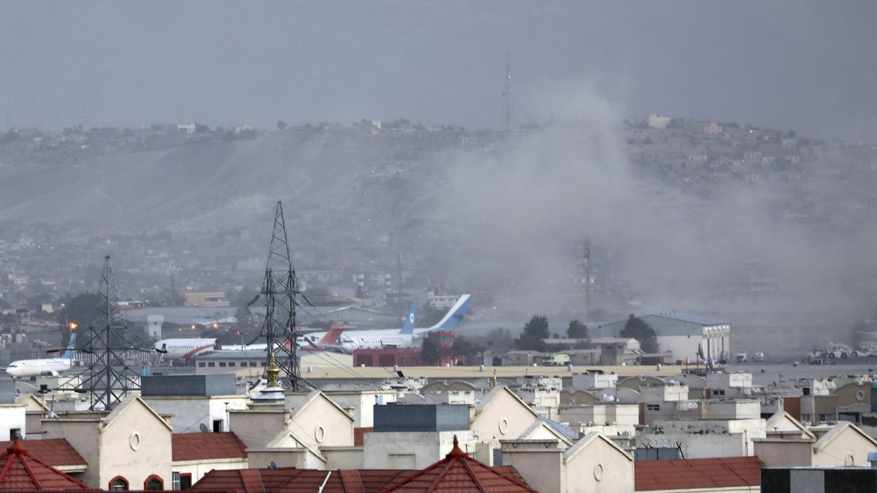 Smoke rises from explosion outside the airport in Kabul, Afghanistan, Thursday, Aug. 26, 2021. (AP Photo/Wali Sabawoon)