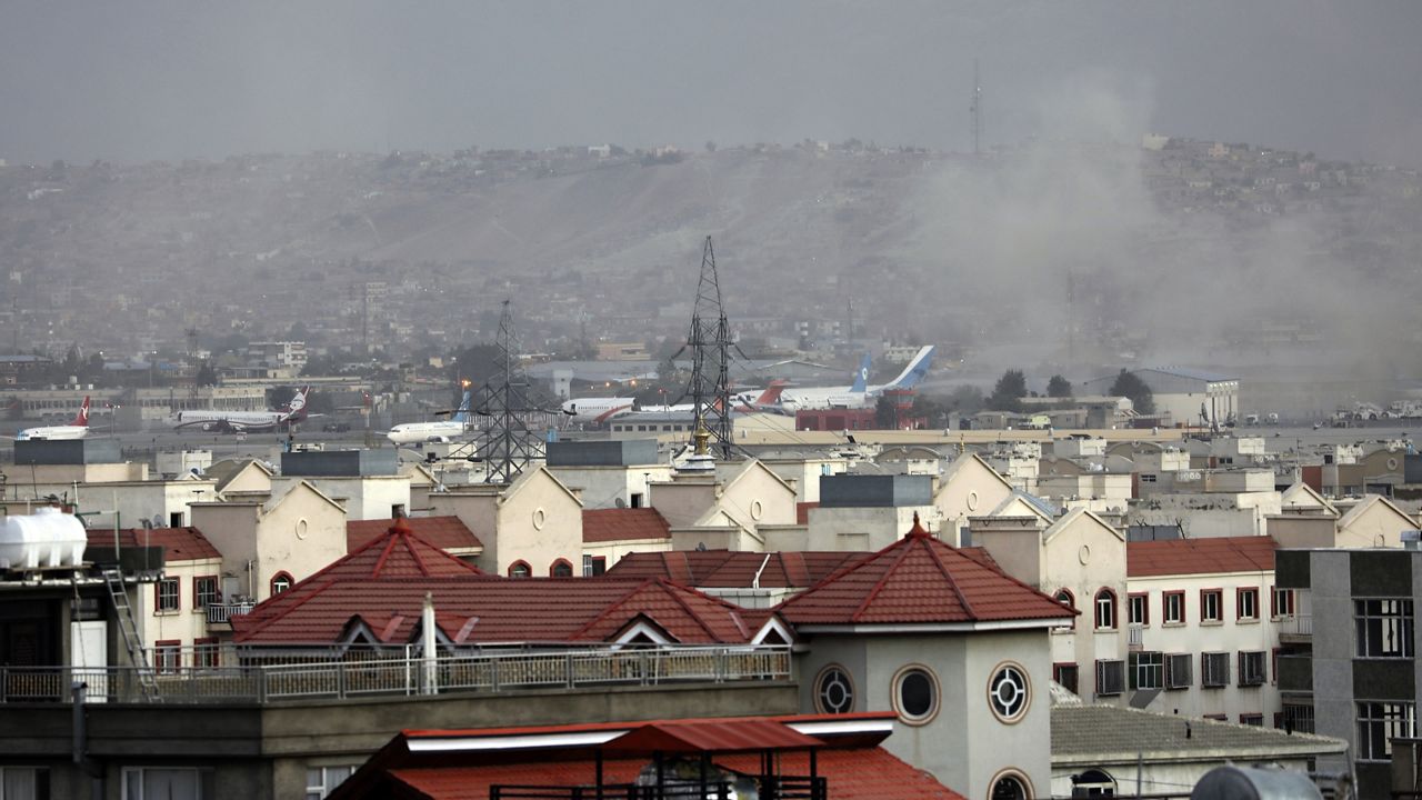 Smoke rises from a deadly explosion outside the airport in Kabul, Afghanistan, Thursday, Aug. 26, 2021. (AP Photo/Wali Sabawoon)