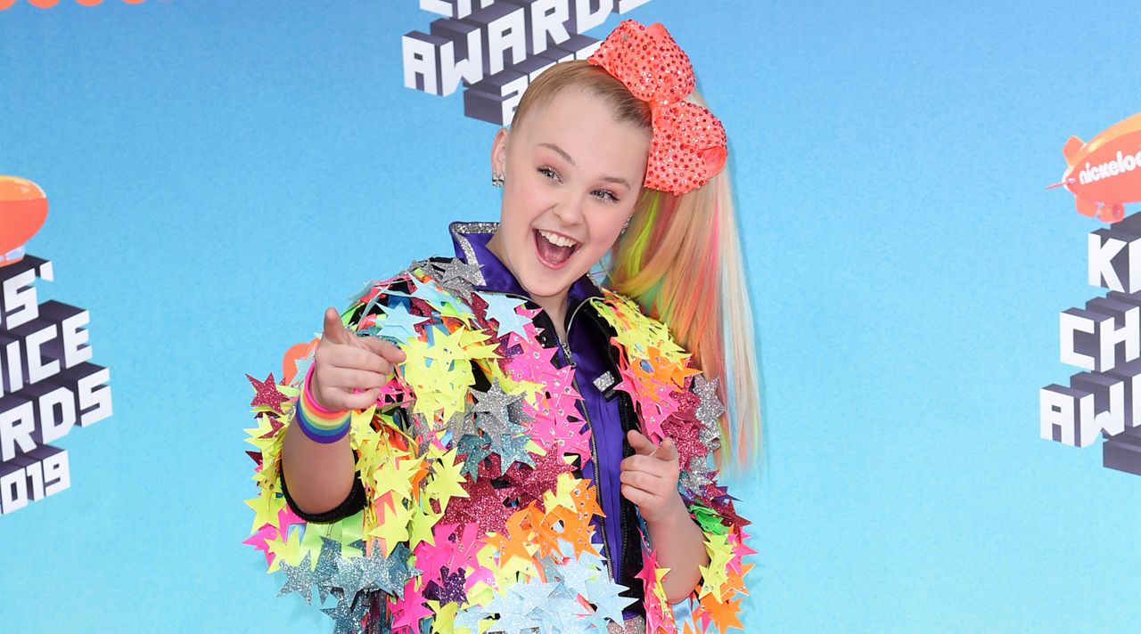 JoJo Siwa arrives at the Nickelodeon Kids' Choice Awards on March 23, 2019, in Los Angeles. Siwa will compete as part of the first same-sex pairing on "Dancing With the Stars" for the show's upcoming 30th season. (Photo by Richard Shotwell/Invision/AP)