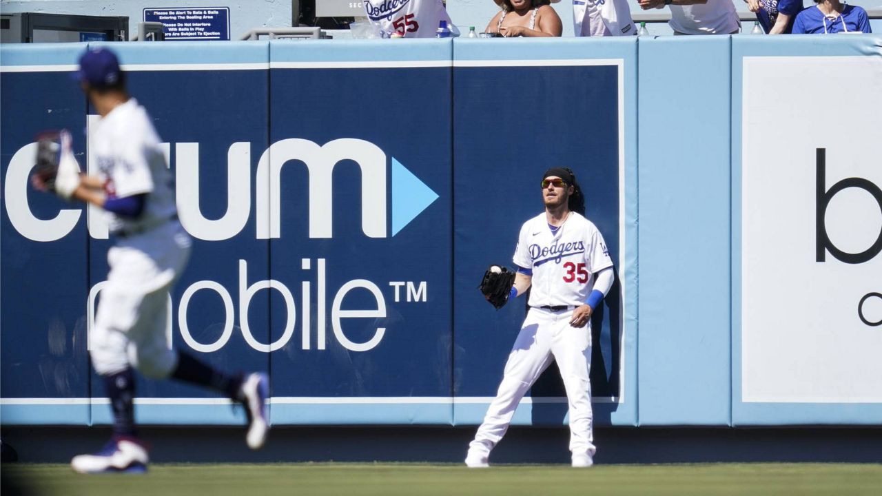 Dodgers center fielder Cody Bellinger (35) reacts after catching a line drive during the sixth inning of a baseball game Sunday, Aug. 29, 2021, in Los Angeles. (AP Photo/Ashley Landis)