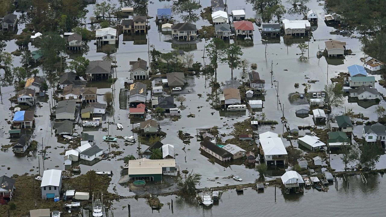 Floodwaters slowly recede in the aftermath of Hurricane Ida in Lafitte, La., on Wednesday. (AP Photo/Gerald Herbert)