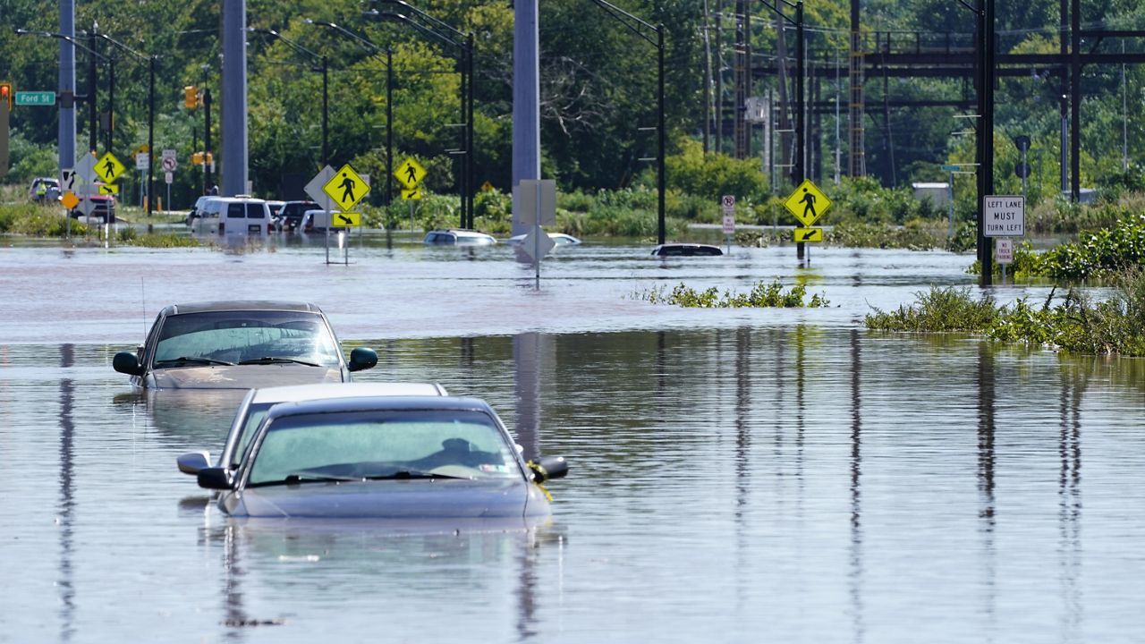 Vehicles are under water during flooding in Norristown, Pa. Thursday, Sept. 2, 2021 in the aftermath of downpours and high winds from the remnants of Hurricane Ida that hit the area. (AP Photo/Matt Rourke)