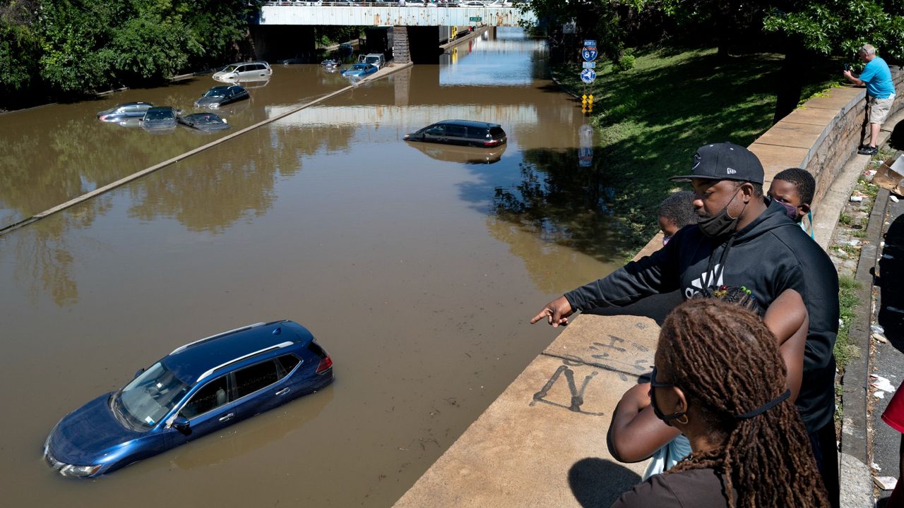 Cars and trucks remained stranded in high water left behind by Hurricane Ida on the Major Deegan Expressway in the Bronx the day after the storm, Sept. 2, 2021. (AP Photo/Craig Ruttle)  