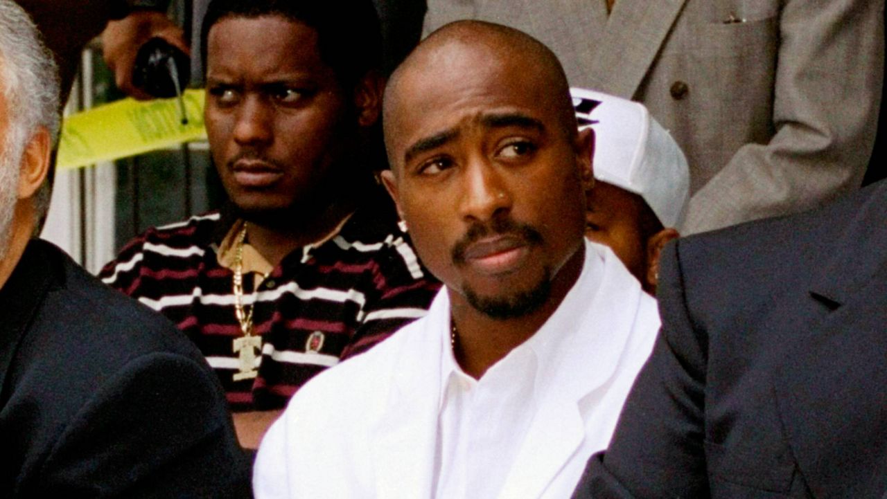 Rapper Tupac Shakur attends a voter registration event in South Central Los Angeles on Aug. 15, 1996. (AP Photo/Frank Wiese, File)