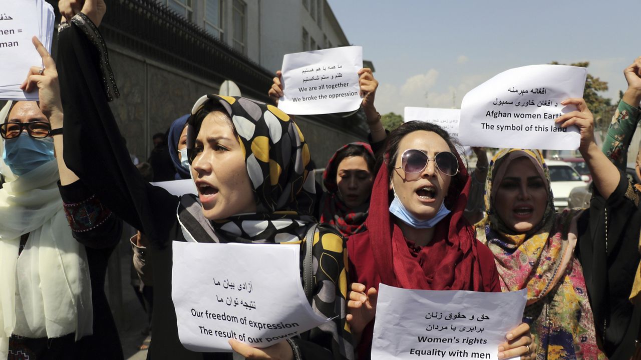 Women gather to demand their rights under the Taliban rule during a protest in Kabul, Afghanistan, Friday, Sept. 3, 2021. (AP Photo/Wali Sabawoon)