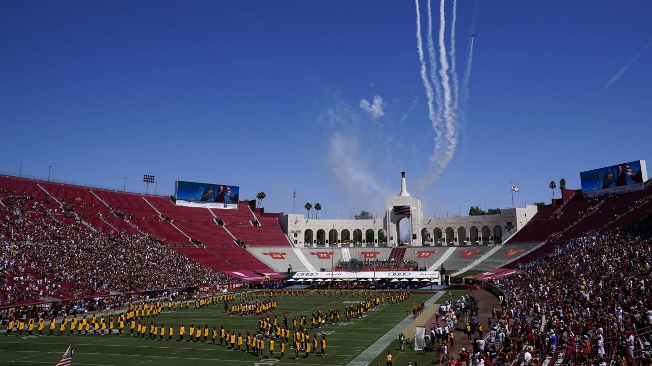 Airplanes fly over Los Angeles Memorial Coliseum before an NCAA college football game between San Jose State and Southern California, Sept. 4, 2021, in Los Angeles. (AP Photo/Ashley Landis)