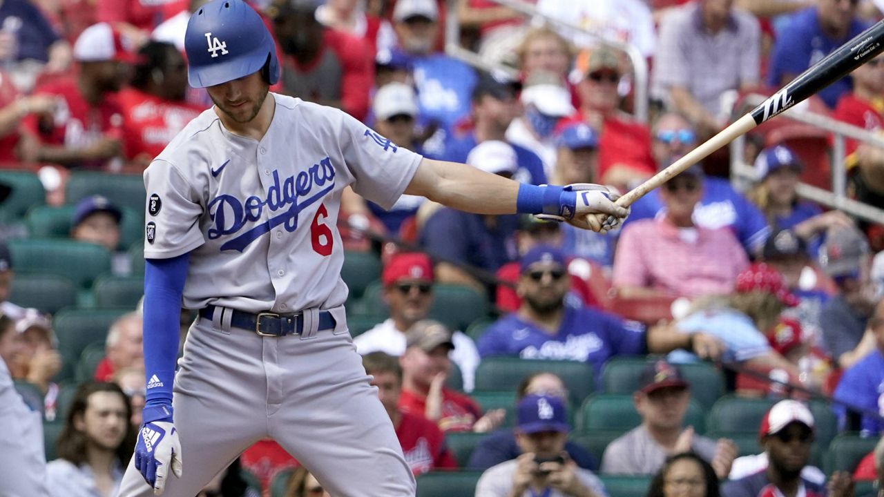 Los Angeles Dodgers' Trea Turner pauses at the plate after striking out swinging during the fifth inning of a baseball game against the St. Louis Cardinals Thursday, Sept. 9, 2021, in St. Louis. (AP Photo/Jeff Roberson)