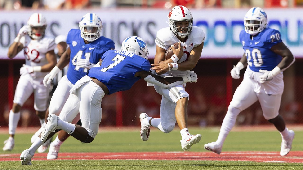 Detroit Lions quarterback Adrian Martinez (18) keeps the ball