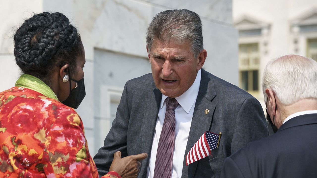 Sen. Joe Manchin, D-W.Va., speaks with Rep. Sheila Jackson Lee, D-Tex., left, and Rep. Mike Thomspon, D-Calif., on the steps of the Capitol following a Sept. 11 remembrance ceremony, in Washington, Monday, Sept. 13, 2021. (AP Photo/J. Scott Applewhite)