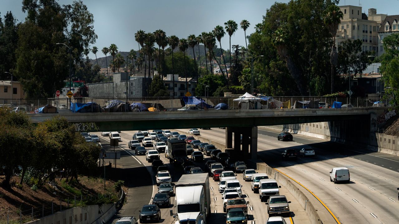 In this July 7, 2021, file photo homeless encampments are installed on an overpass of the CA-101 Hollywood freeway in Los Angeles. (AP Photo/Damian Dovarganes, File)
