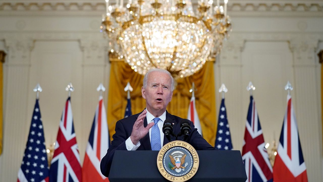 President Joe Biden, joined virtually by Australian Prime Minister Scott Morrison and British Prime Minister Boris Johnson, speaks about a national security initiative from the East Room of the White House in Washington. (AP Photo/Andrew Harnik)