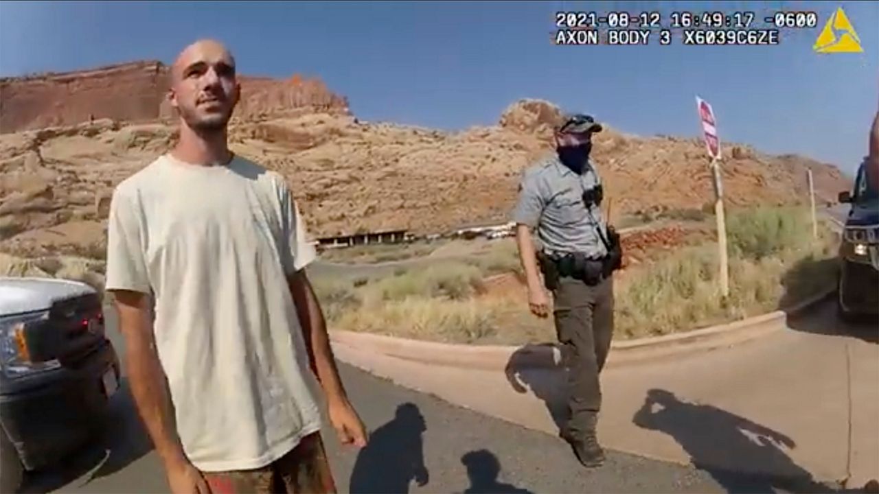 This police camera video provided by The Moab Police Department shows Brian Laundrie talking to a police officer after police pulled over the van he was traveling in with his girlfriend, Gabrielle “Gabby” Petito, near the entrance to Arches National Park on Aug. 12, 2021. (The Moab Police Department via AP)