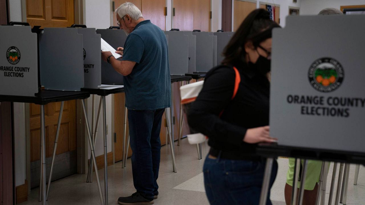 In this Sept. 14, 2021, file photo, voters cast their ballots at a voting center in the Orange County city of La Habra, Calif. (AP Photo/Jae C. Hong)