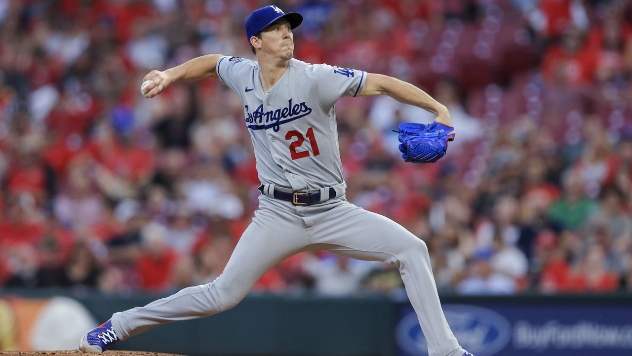 Los Angeles Dodgers' Walker Buehler throws during the first inning of the team's baseball game against the Cincinnati Reds in Cincinnati, Friday, Sept. 17, 2021. (AP Photo/Aaron Doster)