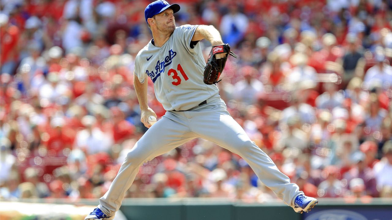 Los Angeles Dodgers' Max Scherzer throws during the first inning of a baseball game Saturday against the Cincinnati Reds in Cincinnati. (AP Photo/Aaron Doster)
