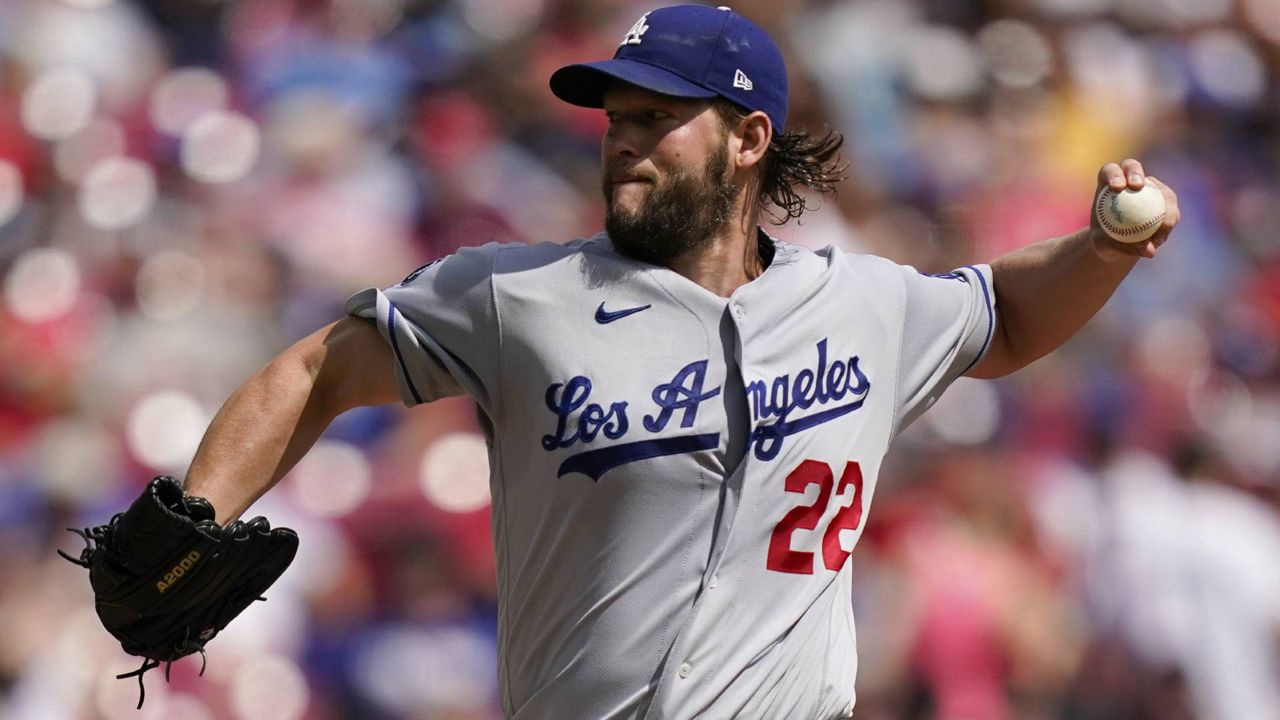 Los Angeles Dodgers starting pitcher Clayton Kershaw (22) delivers during the first inning of a baseball game against the Cincinnati Reds in Cincinnati, Sunday, Sept 19, 2021. (AP Photo/Bryan Woolston)