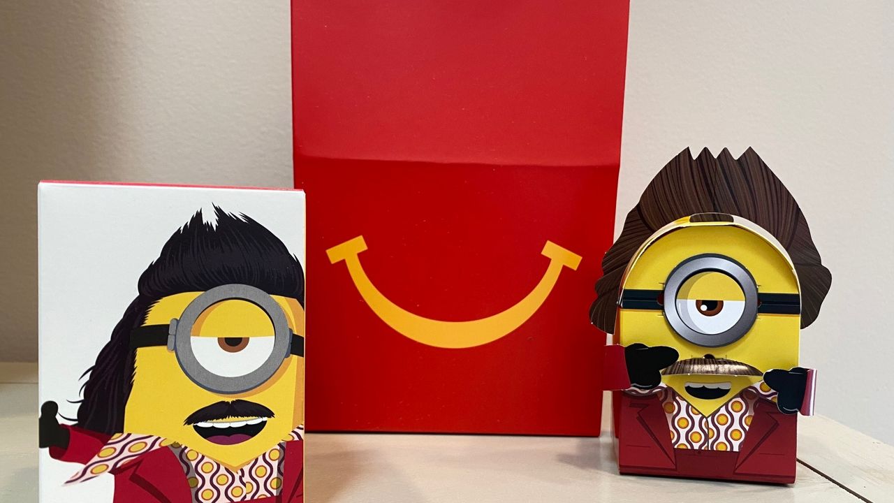 A cardboard McDonald’s Happy Meal toy is shown with a Happy Meal box on Sept. 20, 2021. McDonald’s plans to “drastically” reduce the plastic in its Happy Meal toys worldwide by 2025. (AP Photo/Dee-Ann Durbin)