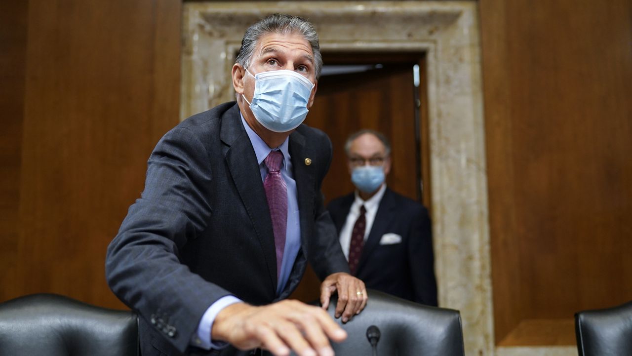 Sen. Joe Manchin, D-W.Va., arrives to chair the Senate Energy and Natural Resources Committee, as congressional Democrats speed ahead this week in pursuit of President Joe Biden's $3.5 trillion plan for social and environmental spending, at the Capitol in Washington, Tuesday, Sept. 21, 2021. (AP Photo/J. Scott Applewhite)