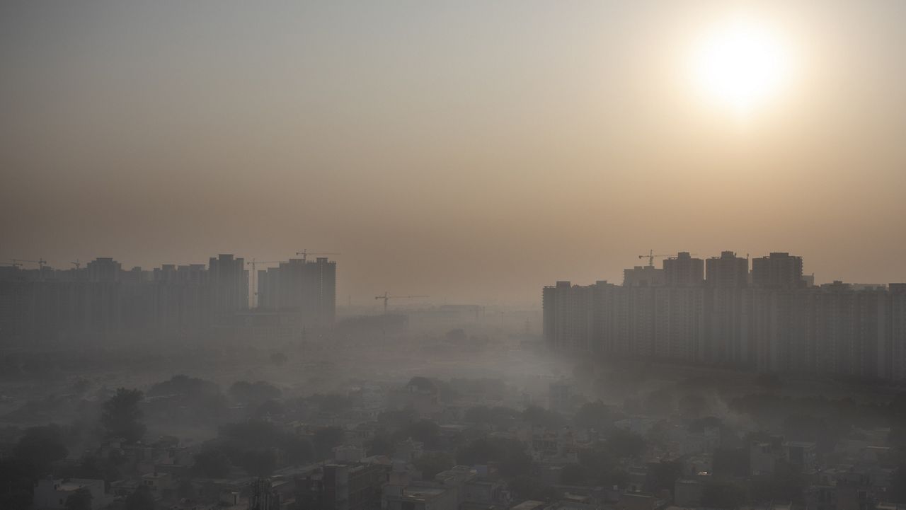 FILE - In this Friday, Oct. 16, 2020 file photo, morning haze envelops the skyline on the outskirts of New Delhi, India. (AP Photo/Altaf Qadri, File)