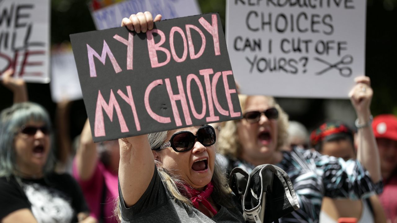 FILE - A group gathers to protest abortion restrictions at the State Capitol in Austin, Texas, Tuesday, May 21, 2019. Abortion rights advocates say the pandemic has demonstrated the value of medical care provided virtually, including the privacy and convenience of abortion taking place in a woman’s home, instead of a clinic.(AP Photo/Eric Gay, File)