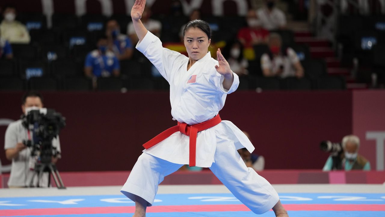 In this Aug. 5, 2021, file photo, Sakura Kokumai, of the United States, competes in the elimination round of the women's kata for Karate at the 2020 Summer Olympics, in Tokyo, Japan.  (AP Photo/Vincent Thian, File)