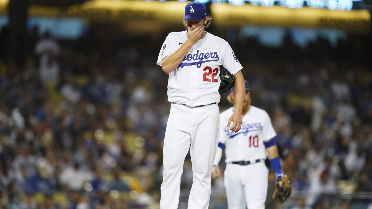 Los Angeles Dodgers starting pitcher Clayton Kershaw (22) reacts on the mound before he exits the game during the second inning of a baseball game against the Milwaukee Brewers Friday, Sept. 1, 2021, in LA. (AP Photo/Ashley Landis)
