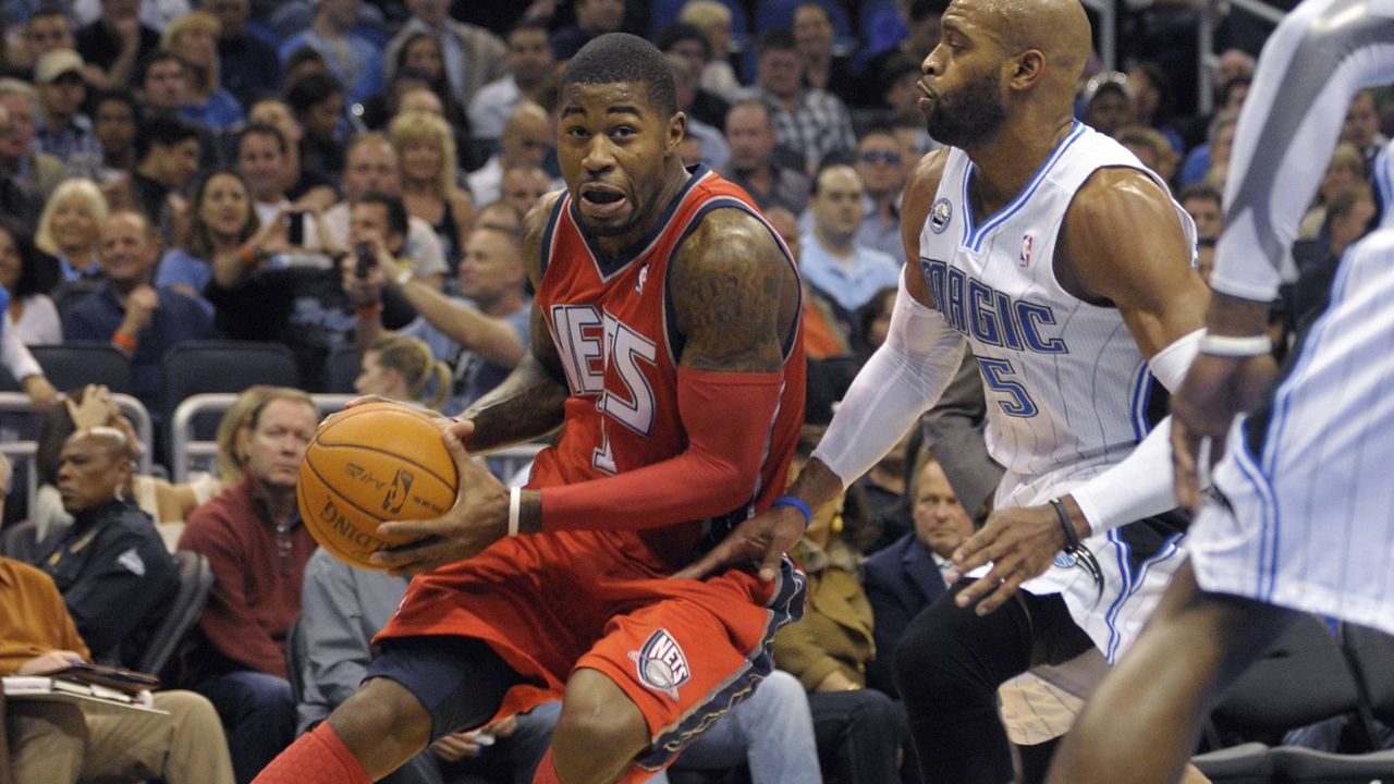 Former New Jersey Net Terrence Williams, left, was the "linchpin" of a scheme to defraud the NBA's health and welfare benefit plan out of nearly $4 million, a federal prosecutor said Thursday. (AP Photo/Phelan M. Ebenhack, File)