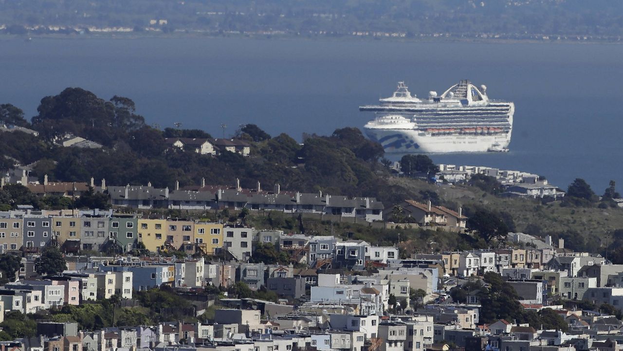 In this March 31, 2020, file photo, the Grand Princess cruise ship, carrying crew and passengers struck with the coronavirus, is shown in San Francisco. Cruise ships are returning to San Francisco after a 19-month hiatus in what's sure to be a boost to the city's economy, the mayor announced Friday. (AP Photo/Jeff Chiu, File)