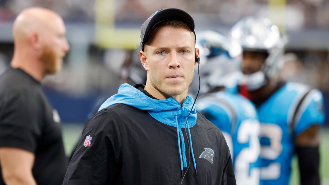 In this Sunday, Oct. 3, 2021, file photo, Carolina Panthers running back Christian McCaffrey watches play from the sideline during the first half of a NFL football game against the Dallas Cowboys in Arlington, Texas. McCaffrey did not practice Thursday, Oct. 14, 2021, a sign that he could miss his third straight game while trying to rehab from a hamstring injury. (AP Photo/Michael Ainsworth)