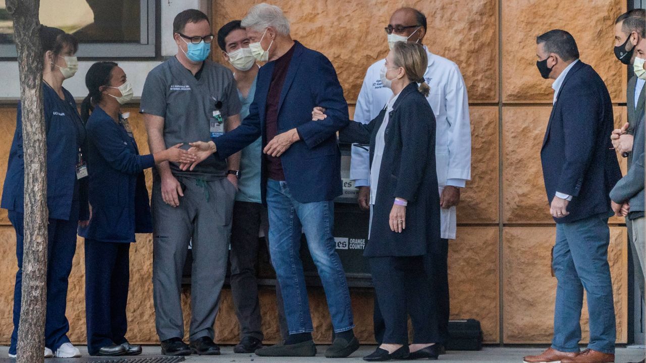 Former President Bill Clinton, and former first lady and former U.S. Secretary of State Hillary Clinton thank members of the medical staff as he is released from the University of California Irvine Medical Center in Orange, Calif., Sunday, Oct. 17, 2021. (AP Photo/Damian Dovarganes)