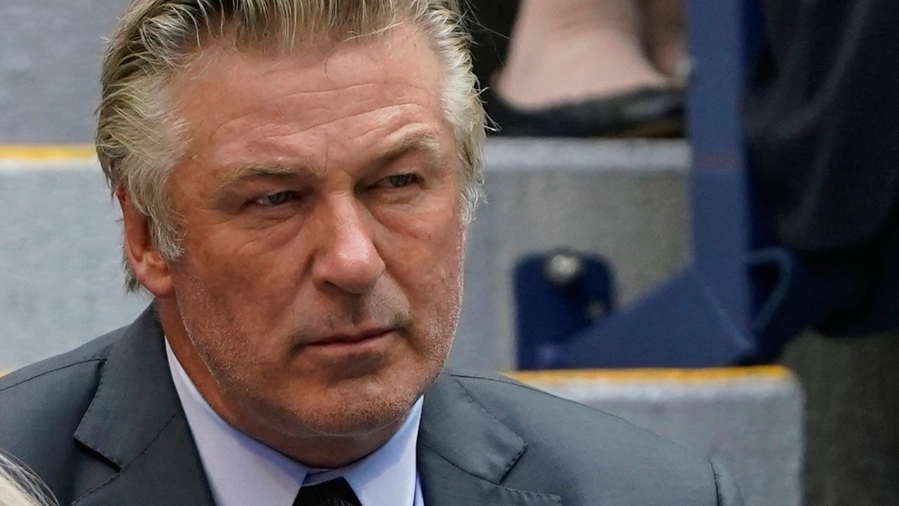 FILE - In this Sunday, Sept. 12, 2021, photo Alec Baldwin watches the men's singles final of the US Open tennis championships in New York. (AP Photo/John Minchillo, File)