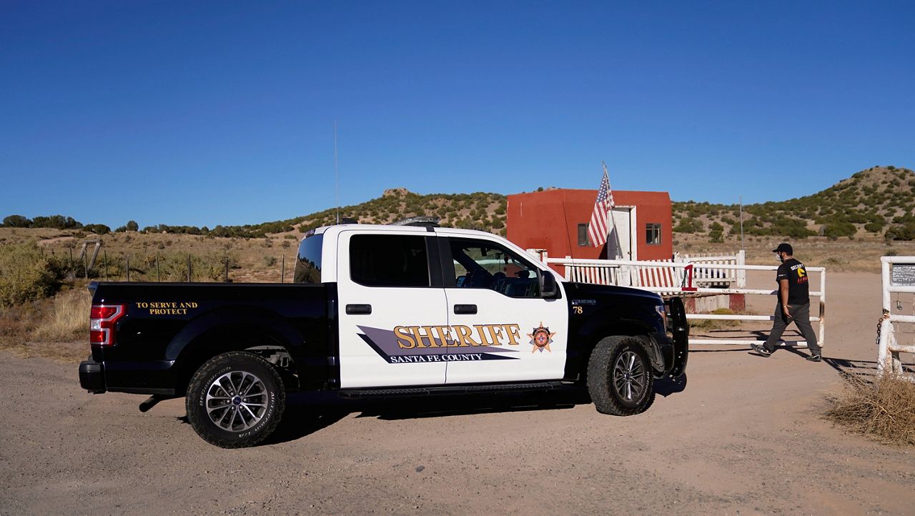 A Santa Fe County Sheriff's vehicle enters Monday the Bonanza Creek Ranch in Santa Fe, N.M., where the movie "Rust" was being filmed. (AP Photo/Jae C. Hong)