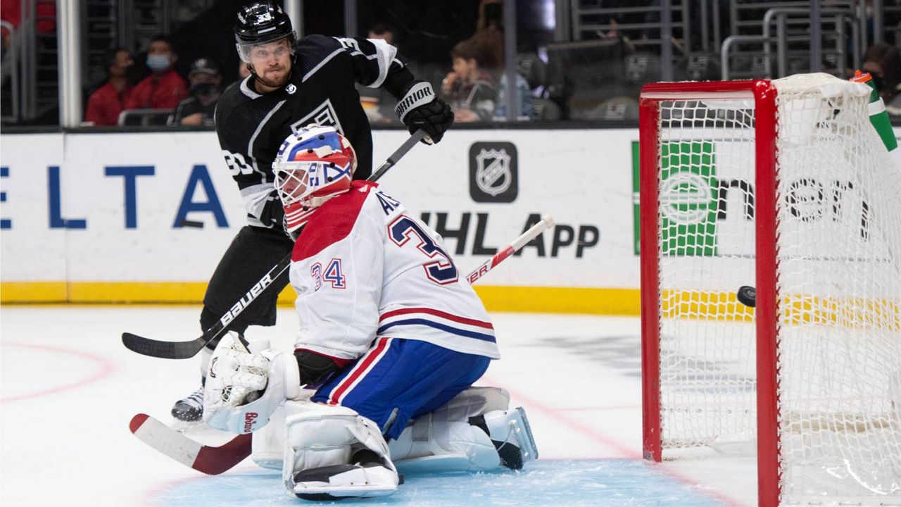 Los Angeles Kings right wing Viktor Arvidsson (33) watches the goal by left wing Arthur Kaliyev (34) go past Montreal Canadiens goaltender Jake Allen (34) during an NHL game, Saturday, Oct. 30, 2021, in LA. (AP Photo/Kyusung Gong)