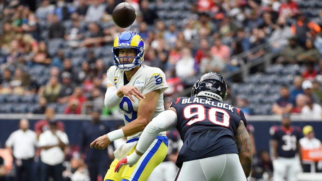 Los Angeles Rams quarterback Matthew Stafford (9) throws as he is pressured by Houston Texans defensive tackle Ross Blacklock (90) during an NFL game, Sunday, Oct. 31, 2021, in Houston. (AP Photo/Justin Rex)