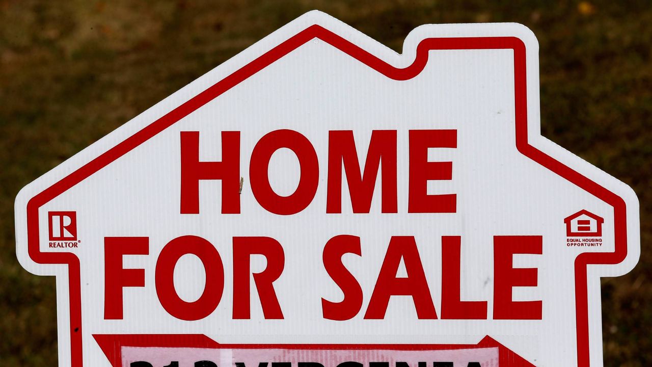 This Oct. 17, 2019, file photo shows a home for sale sign in Orange County near Hillsborough, N.C. (AP Photo/Gerry Broome)
