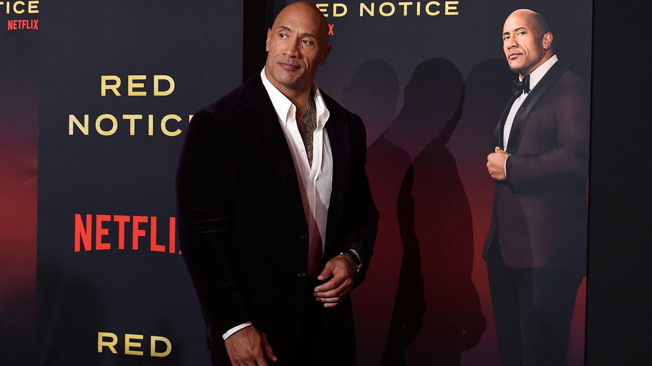 Cast member Dwayne Johnson arrives at the Los Angeles premiere of "Red Notice" at L.A. Live on Wednesday, Nov. 3, 2021. (Photo by Jordan Strauss/Invision/AP)