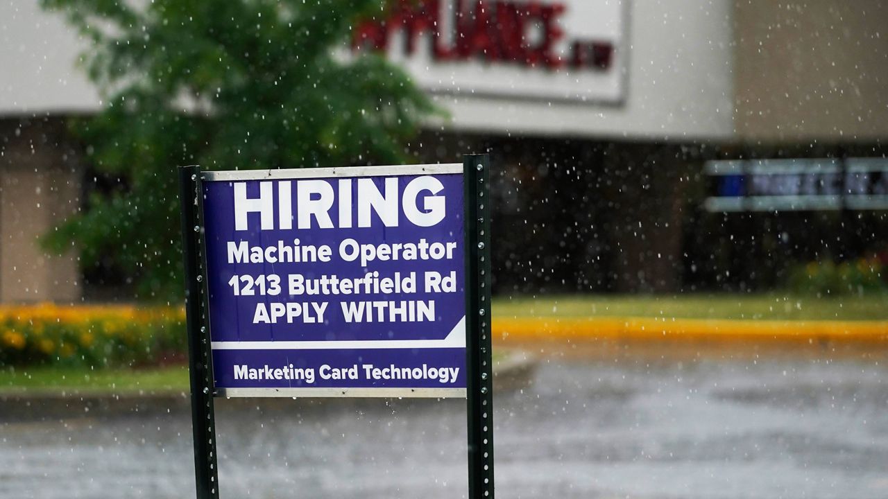 A hiring sign is displayed in Downers Grove, Ill., on June 24, 2021. (AP Photo/Nam Y. Huh, File)