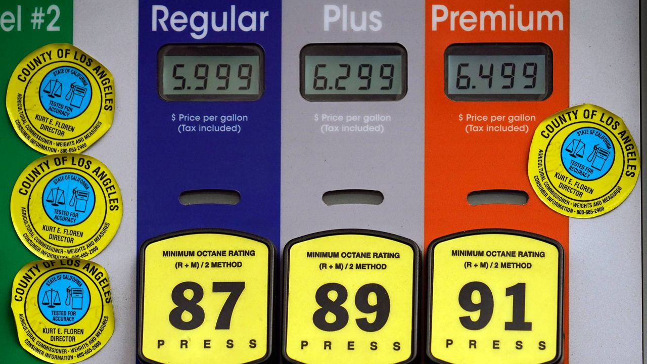 High gas prices are posted at a full service gas station in Beverly Hills, Calif., Nov. 7, 2021. (AP Photo/Damian Dovarganes)