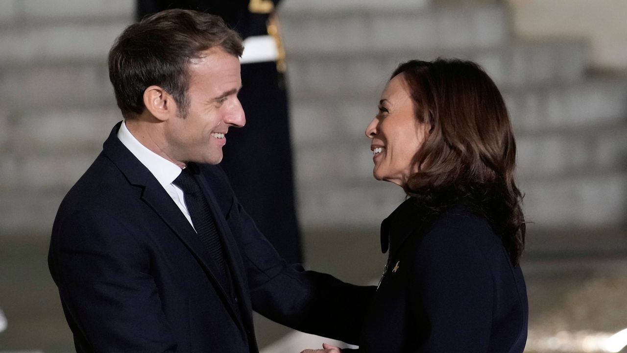 French President Emmanuel Macron welcomes Vice President Kamala Harris on Wednesday at the Elysee Palace in Paris. (AP Photo/Christophe Ena)