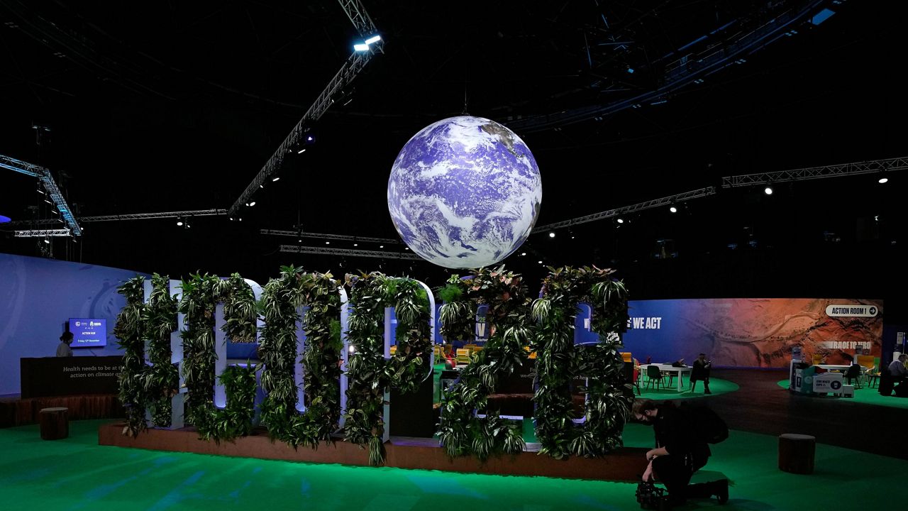 People start to gather near the Action Zone inside the venue of the COP26 U.N. Climate Summit in Glasgow, Scotland, on Friday. (AP Photo/Alastair Grant)