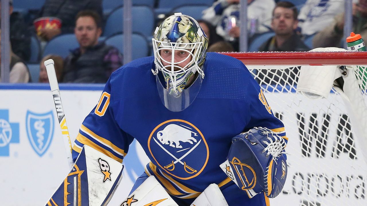 Injured goalie Eric Comrie rejoins Sabres on road trip, looks for