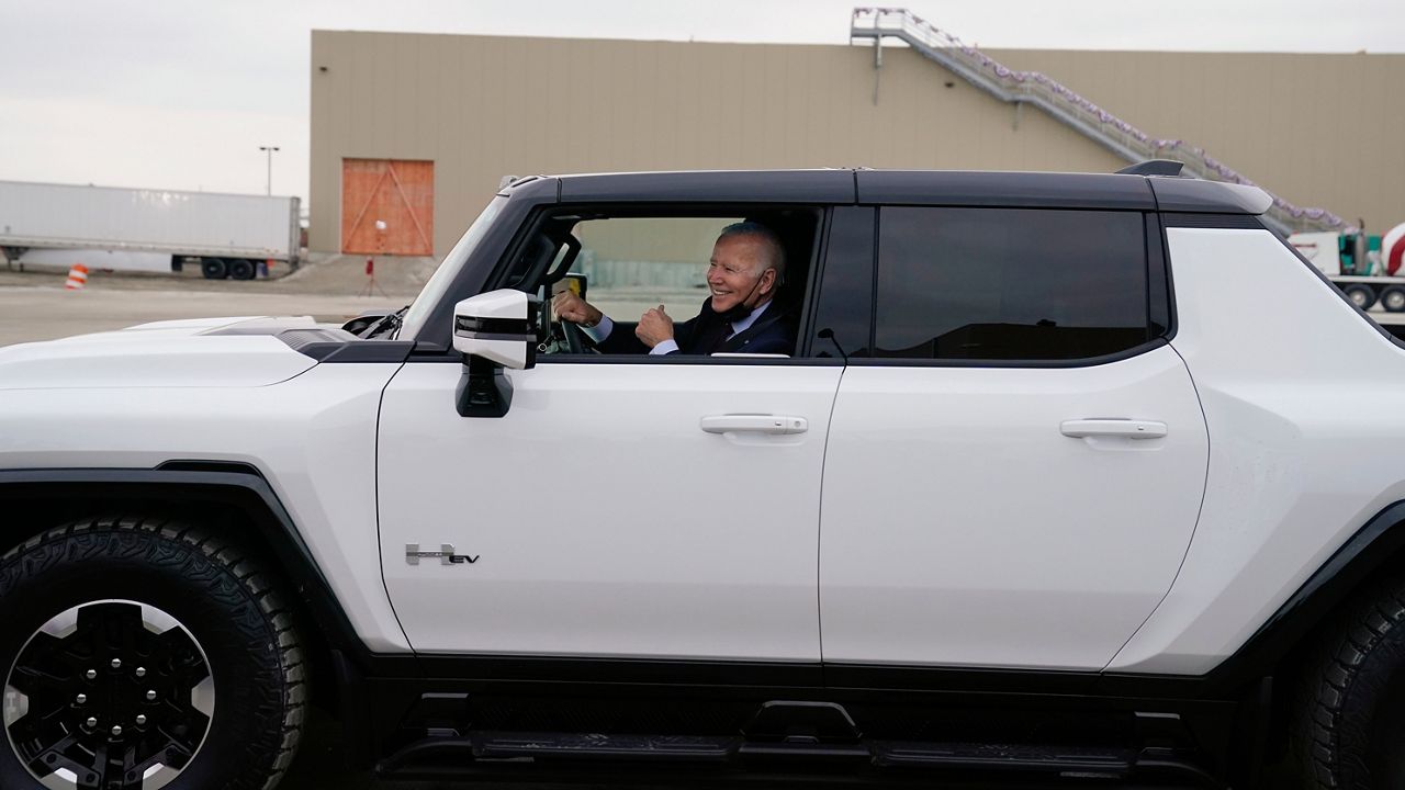 President Joe Biden smiles as he test drives a Hummer during a tour of the General Motors Factory ZERO electric vehicle assembly plant, Wednesday, Nov. 17, 2021, in Detroit. (AP Photo/Evan Vucci)