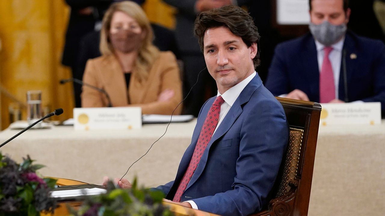 Canadian Prime Minister Justin Trudeau listens as he meets with President Joe Biden and Mexican President Andrés Manuel López Obrador in the East Room of the White House in Washington, Thursday, Nov. 18, 2021. (AP Photo/Susan Walsh)