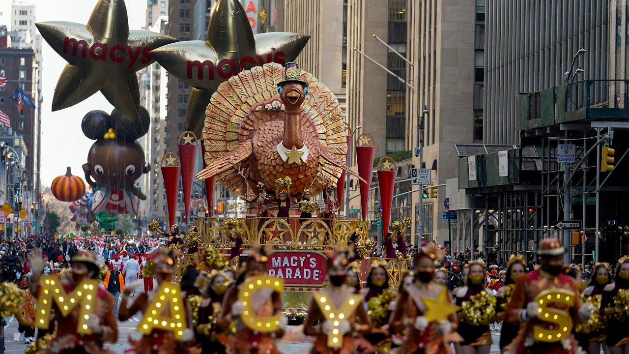 The Tom Turkey float moves down Sixth Avenue during the Macy's Thanksgiving Day Parade in New York, Thursday, Nov. 25, 2021. (AP Photo/Jeenah Moon)