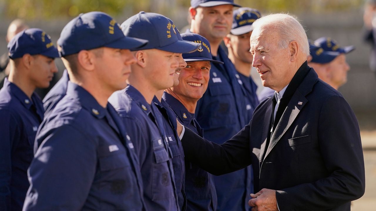 President Joe Biden greets members of the United States Coast Guard at the United States Coast Guard Station Brant Point in Nantucket, Mass., Thursday, Nov. 25, 2021. after virtually meeting with service members from around the world to thank them for their service and wish them a happy Thanksgiving. (AP Photo/Carolyn Kaster)