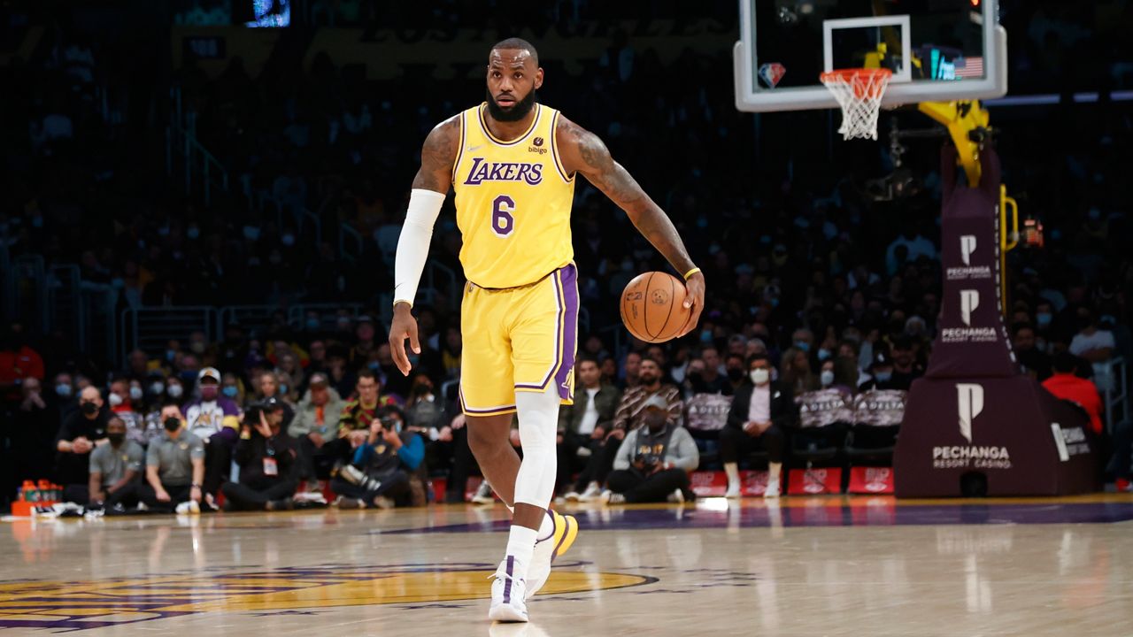 Los Angeles Lakers forward LeBron James (6) dribbles against the Sacramento Kings during the first half of an NBA basketball game in Los Angeles, Friday, Nov. 26, 2021. (AP Photo/Ringo H.W. Chiu)